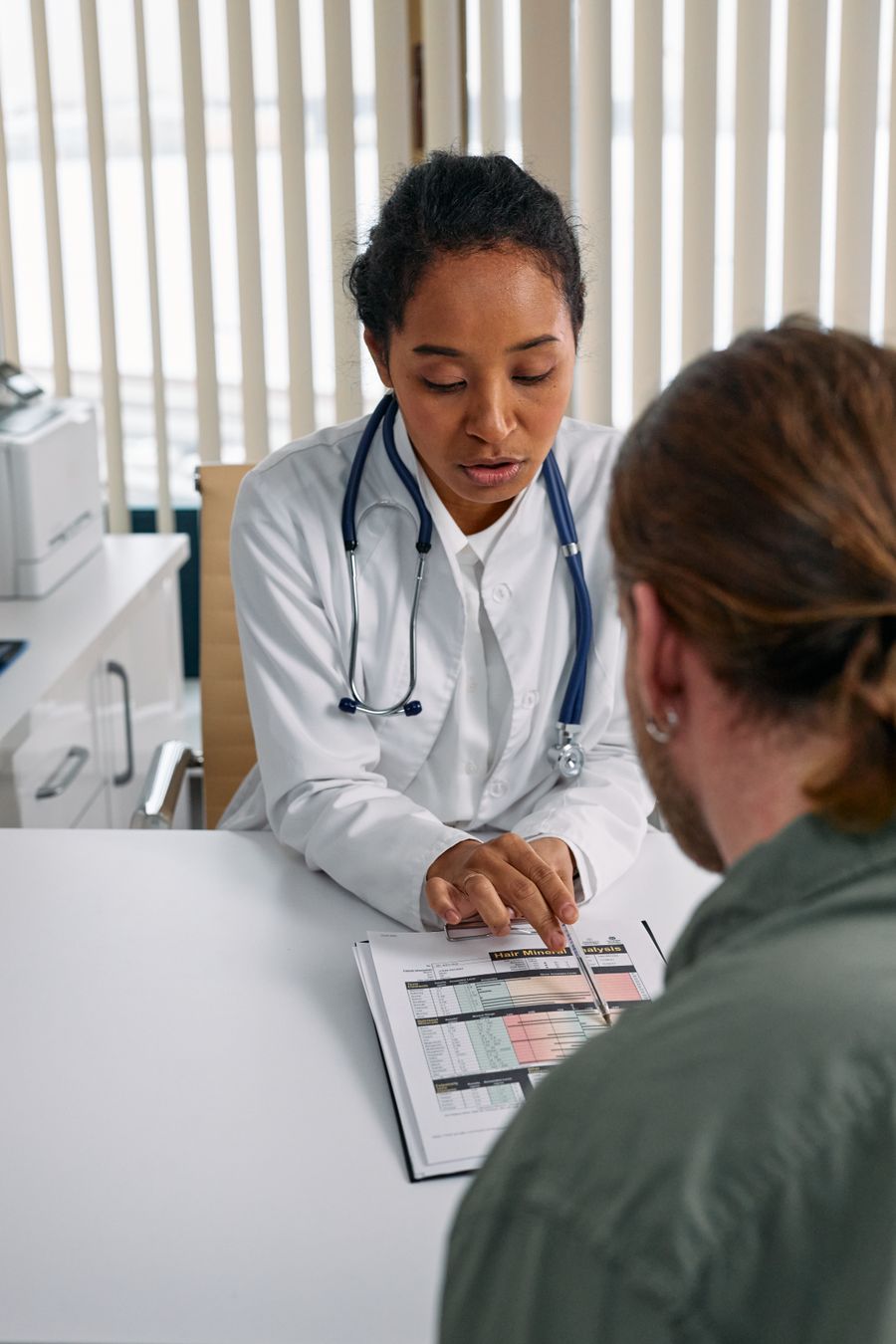 A physician reviewing a patient chart